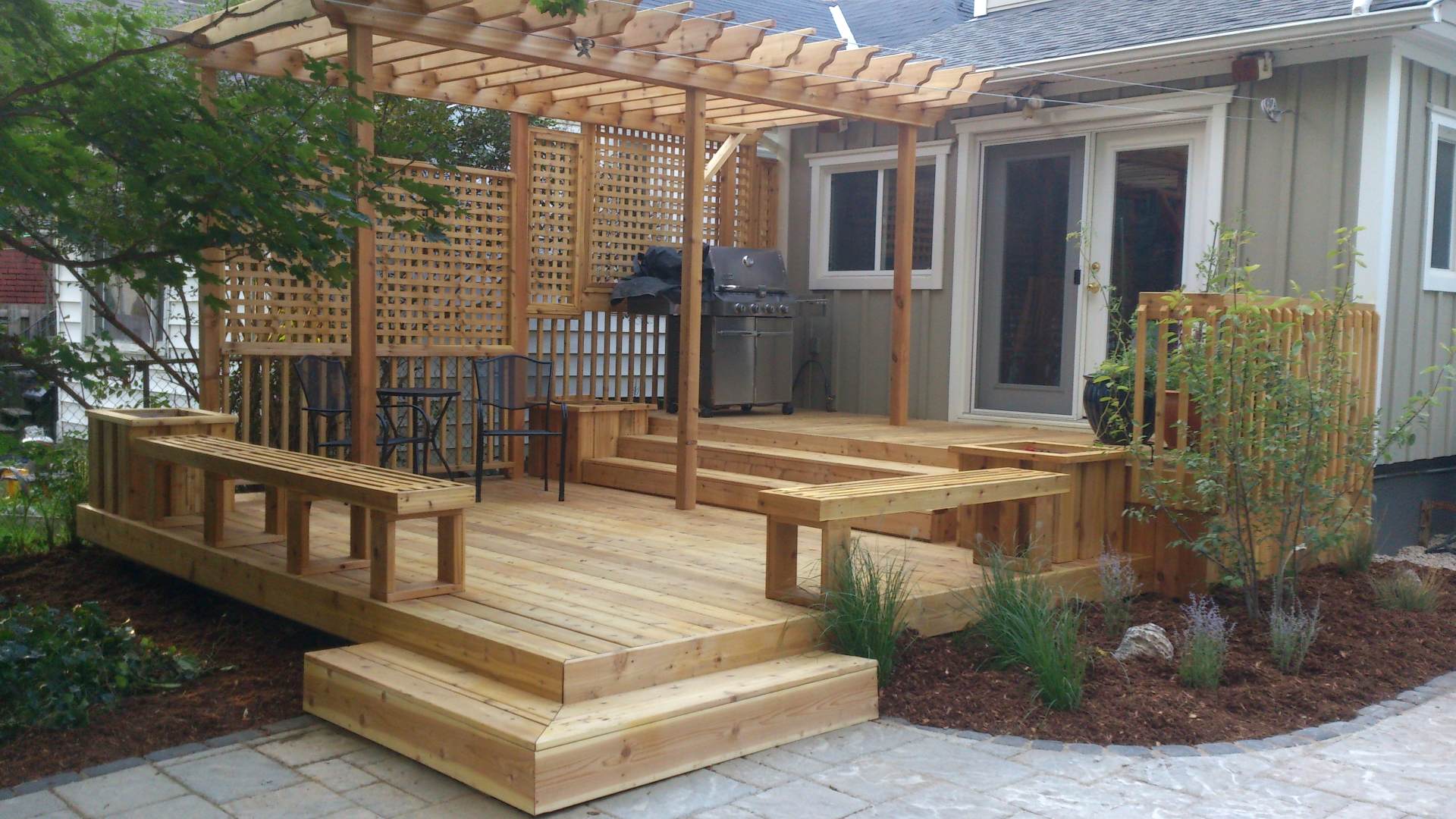 New deck and backyard renovation: a landscaping, hardscaping and woodwork project in London Ontario.