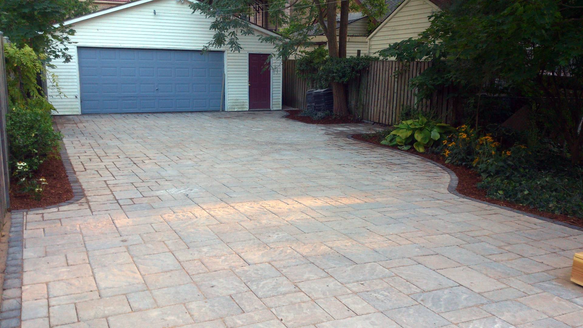 An after photo: interlock driveway installation, a hardscaping project in London Ontario.