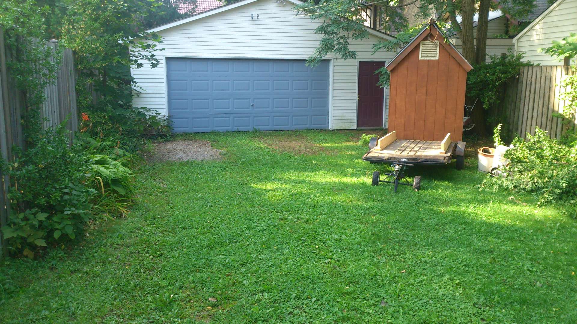 A before photo: interlock driveway installation, a hardscaping project in London Ontario.