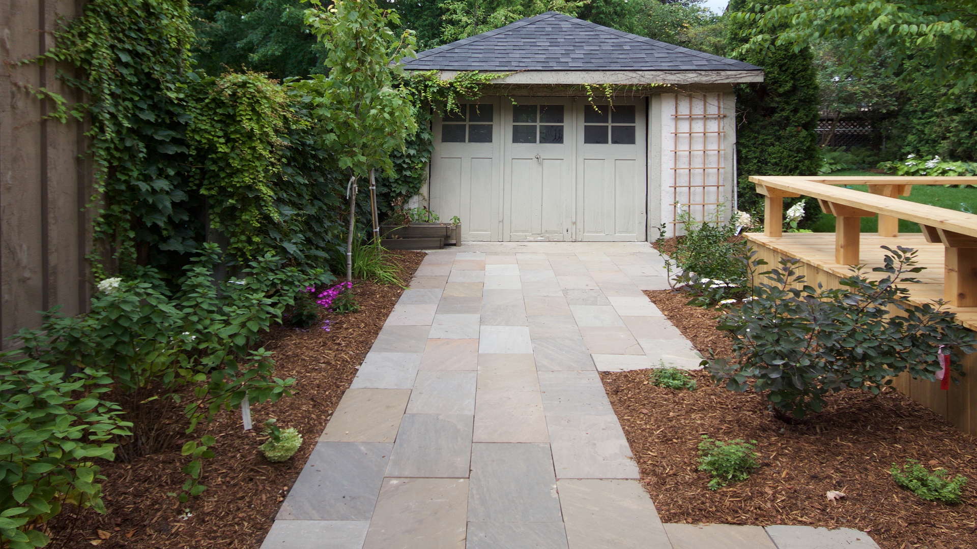 Stone slab driveway and landscape. Modern landscaping project in London Ontario.