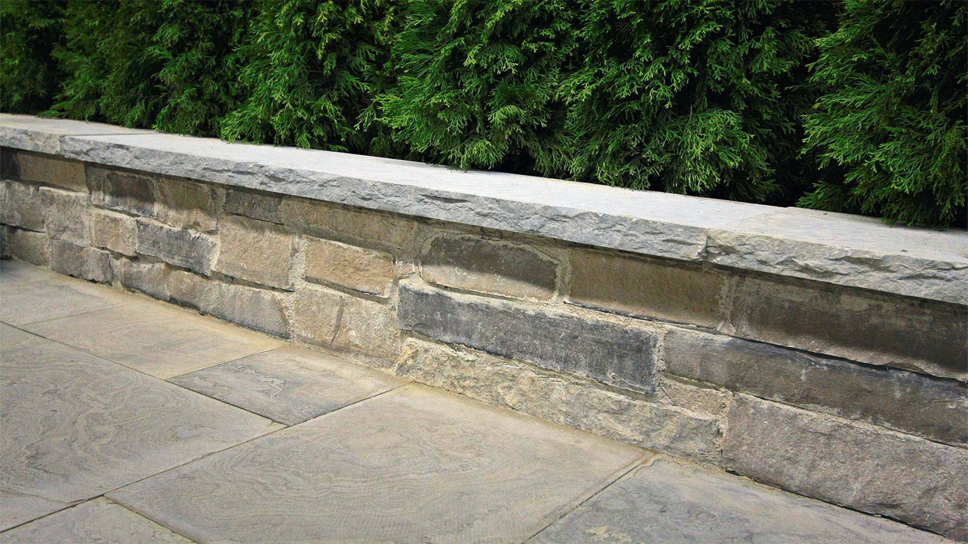 Traditional stonework / hardscaping project in London Ontario. A retaining wall.