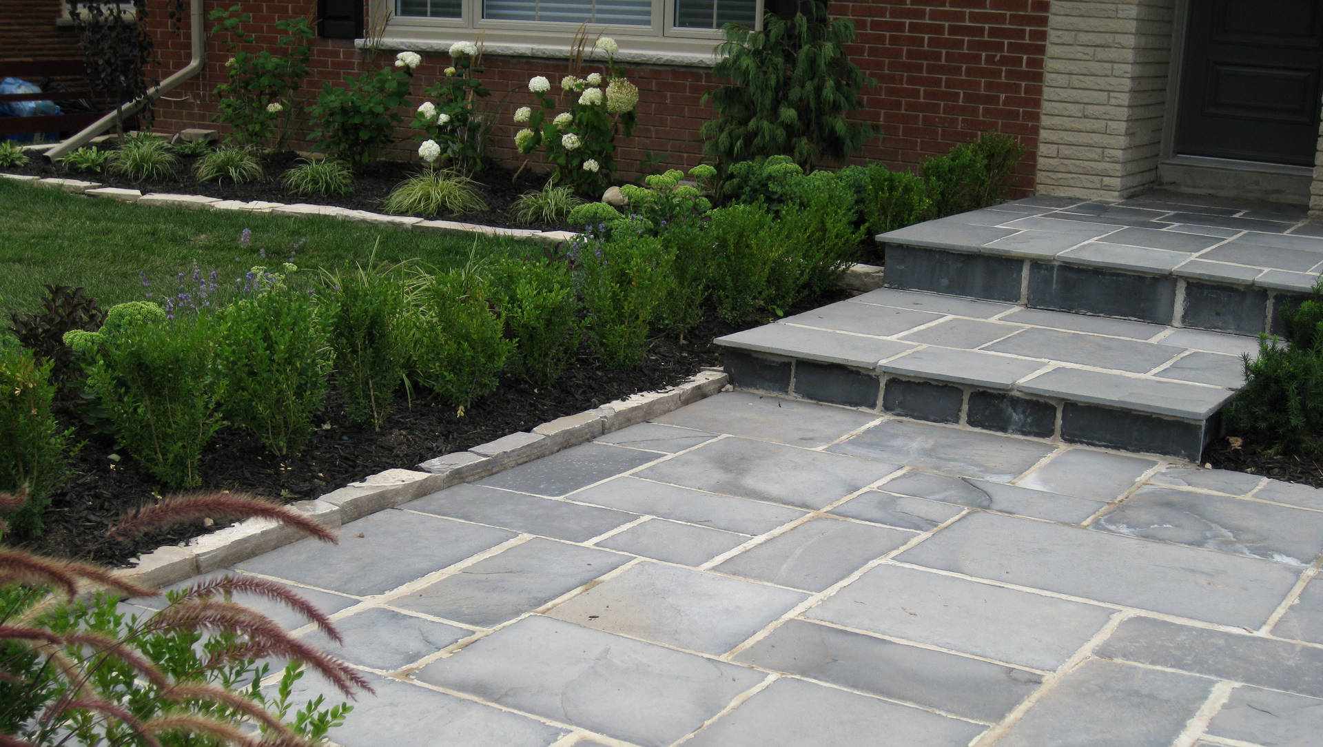 Stone steps and front yard landscaping. Modern landscaping / hardscaping project in London Ontario.